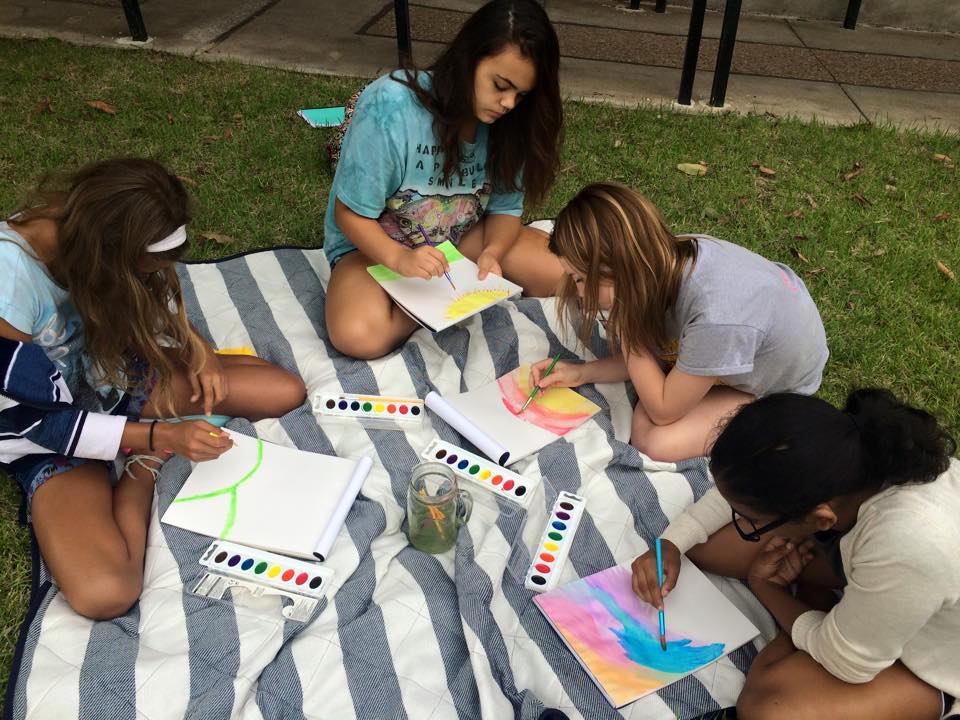 Girls painting with water colors